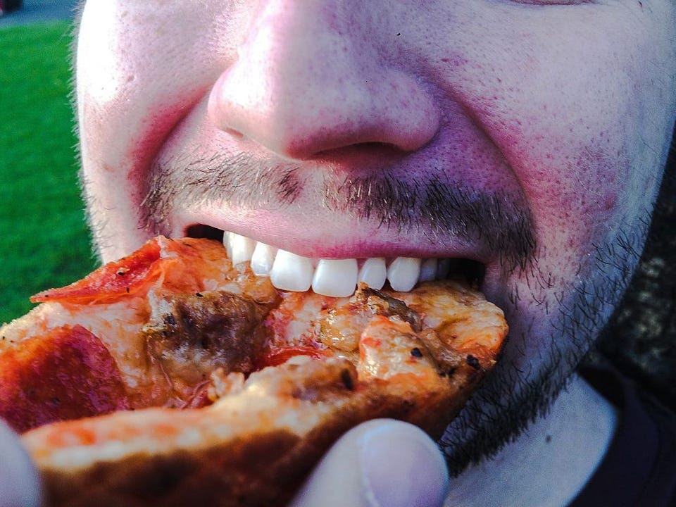 Dead Man Caught Eating Pizza On His Graveyard At Awudome Cemetery