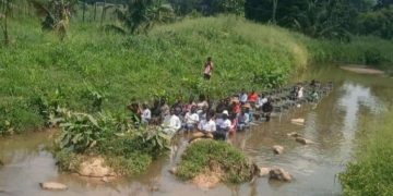 Terrifying Video Shows Some KNUST Students Sitting In A Dangerous River And Having Lectures