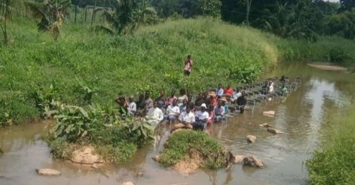Terrifying Video Shows Some KNUST Students Sitting In A Dangerous River And Having Lectures