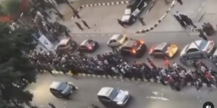 Hundreds Of Nigerians Storm President Tinubu’s Residence, Say They Won’t Leave Until He Gives Each Of Them Christmas Gift