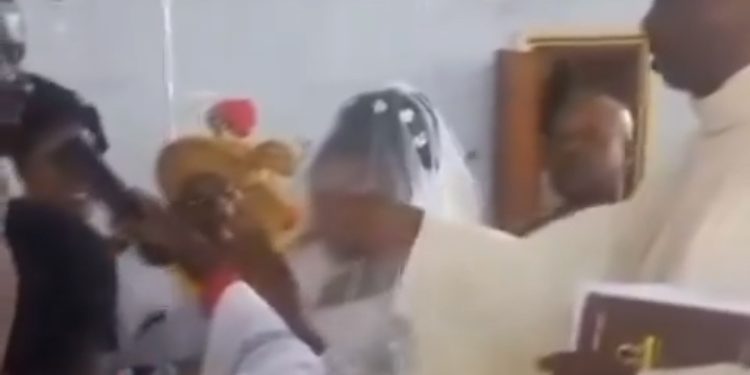 Leaked Video: Catholic Priest Caught Delivering Heavy knock On The Head Of A Mass Server During Marriage Ceremony—Video